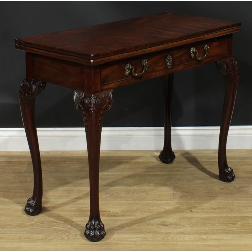 1091 - A George II mahogany card table, possibly Irish, hinged rectangular top enclosing a baize lined play... 