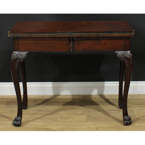 1091 - A George II mahogany card table, possibly Irish, hinged rectangular top enclosing a baize lined play... 