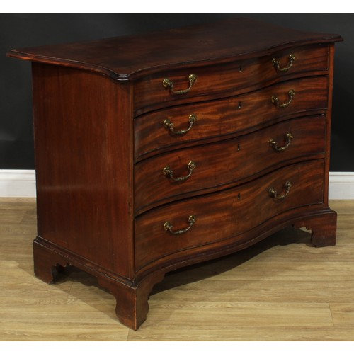 1227 - A George III mahogany serpentine chest, slightly oversailing top with moulded edge above four long g... 