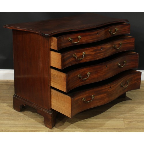 1227 - A George III mahogany serpentine chest, slightly oversailing top with moulded edge above four long g... 