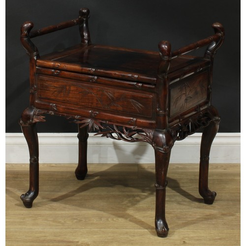 1049 - A Chinese padouk wood piano stool, hinged panel seat, carry handles to sides, carved and incised wit... 