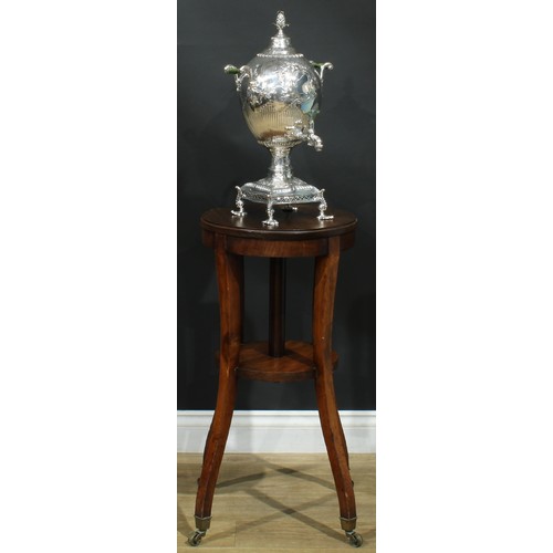 1617 - An unusual 19th century revolving urn or tea kettle stand, circular top turning on three wooden roll... 