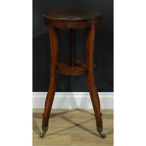 1617 - An unusual 19th century revolving urn or tea kettle stand, circular top turning on three wooden roll... 