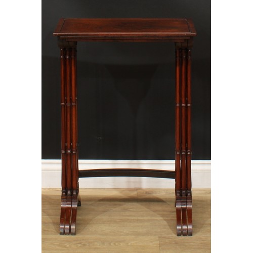 1177 - A George III Revival rosewood nest of three occasional tables, each with a rectangular top and ring-... 