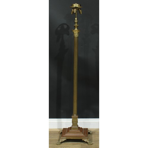 1623 - Interior Design - a brass telescopic floor lamp, Corinthian column, stepped square base, paw feet, 1... 