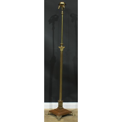 1623 - Interior Design - a brass telescopic floor lamp, Corinthian column, stepped square base, paw feet, 1... 