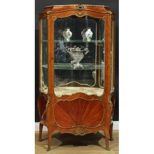 1348 - A Louis XV Revival gilt metal mounted kingwood serpentine vitrine, in the manner of François Linke, ... 