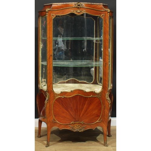 1348 - A Louis XV Revival gilt metal mounted kingwood serpentine vitrine, in the manner of François Linke, ... 