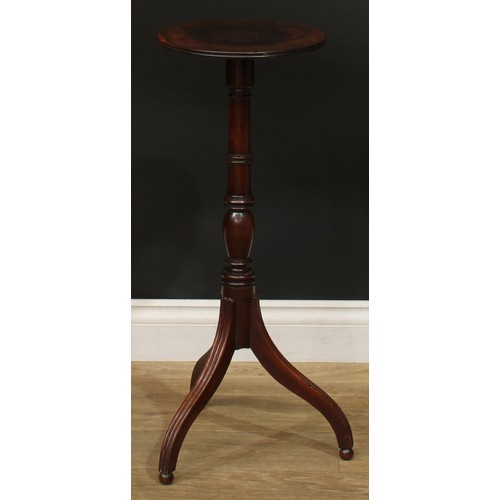 941 - A 19th century mahogany tripod wine table, circular top with channelled edge, turned column, reeded ... 