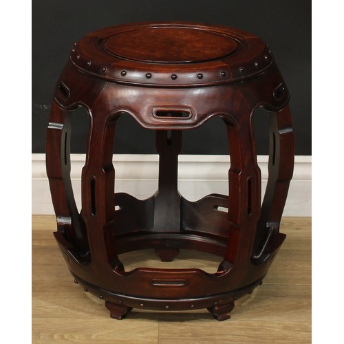 1378 - A pair of Chinese hardwood barrel-form seats or low tables, each with a circular top, shaped and pie... 