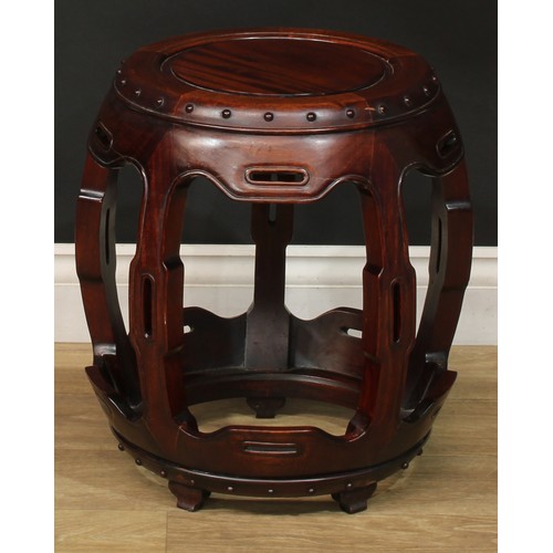 1378 - A pair of Chinese hardwood barrel-form seats or low tables, each with a circular top, shaped and pie... 