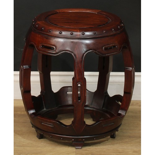 1378 - A pair of Chinese hardwood barrel-form seats or low tables, each with a circular top, shaped and pie... 