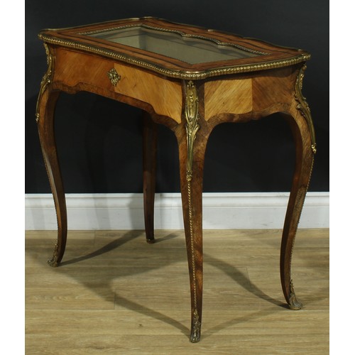 1347 - A Louis XV Revival gilt metal mounted kingwood bijouterie table, shaped rectangular top with inset g... 