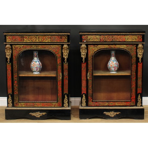 1373 - A pair of 19th century gilt metal mounted Boulle and ebonised pier display cabinets, each with an ov... 