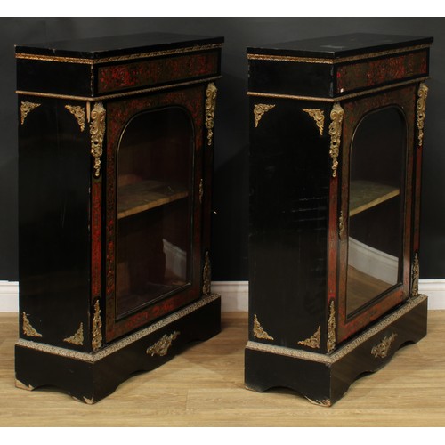 1373 - A pair of 19th century gilt metal mounted Boulle and ebonised pier display cabinets, each with an ov... 