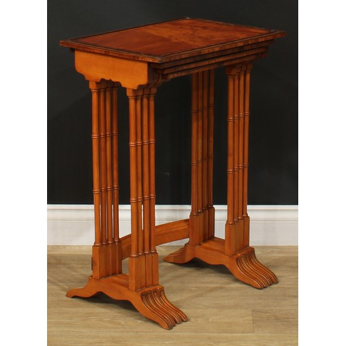 1179 - A George III Revival set of rosewood crossbanded satinwood quartetto tables, each with a rectangular... 