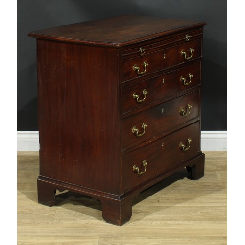 1102 - A George III mahogany bachelor’s chest, rectangular top with moulded edge above a slide and four lon... 