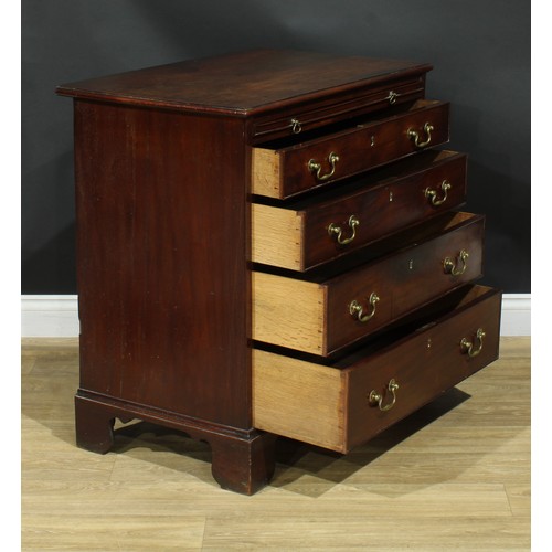 1102 - A George III mahogany bachelor’s chest, rectangular top with moulded edge above a slide and four lon... 