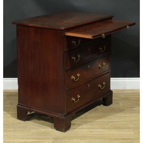 1102 - A George III mahogany bachelor’s chest, rectangular top with moulded edge above a slide and four lon... 