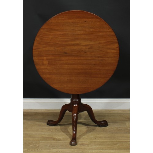 1104 - A George III mahogany birdcage tripod occasional table, one-piece circular tilting top, turned colum... 