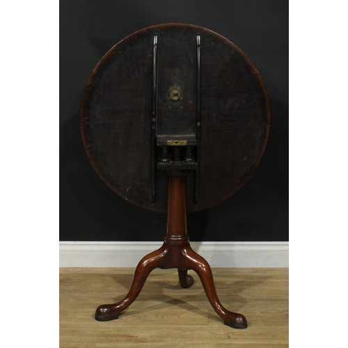 1104 - A George III mahogany birdcage tripod occasional table, one-piece circular tilting top, turned colum... 