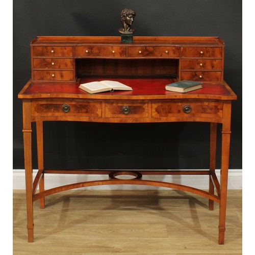 1181 - A George III style yew veneer Carlton House type desk, the superstructure with eight small drawers, ... 