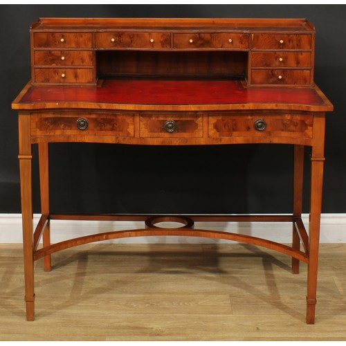 1181 - A George III style yew veneer Carlton House type desk, the superstructure with eight small drawers, ... 