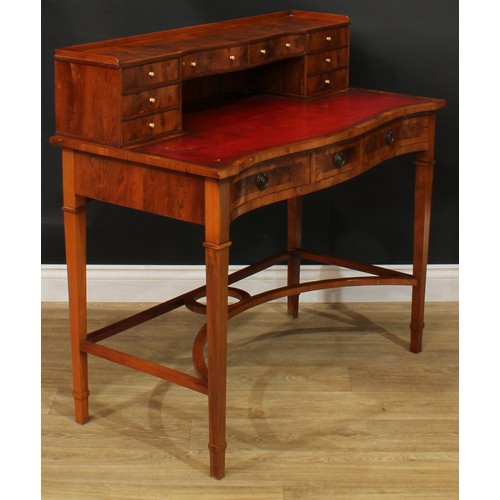 1181 - A George III style yew veneer Carlton House type desk, the superstructure with eight small drawers, ... 