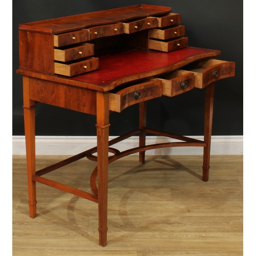 1181 - A George III style yew veneer Carlton House type desk, the superstructure with eight small drawers, ... 