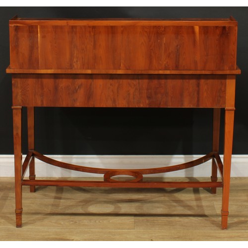 1181 - A George III style yew veneer Carlton House type desk, the superstructure with eight small drawers, ... 