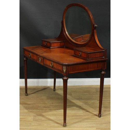 1355 - A Louis XVI Revival satinwood crossbanded coiffeuse or dressing table, the superstructure with bevel... 