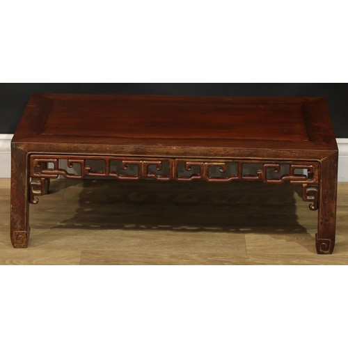 1032 - A Chinese hardwood low kang or tea table, rectangular top, shaped and pierced apron carved with styl... 