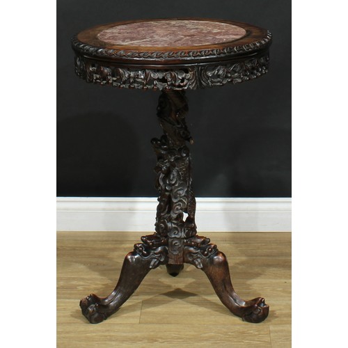 1044 - A Chinese hardwood tripod occasional table, circular top with inset marble panel above a shaped frie... 