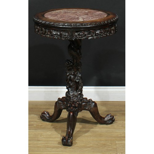 1044 - A Chinese hardwood tripod occasional table, circular top with inset marble panel above a shaped frie... 