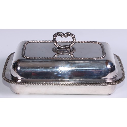 31 - A Regency Old Sheffield Plate rounded rectangular warming entree dish, reeded loop handle, scroll ha... 