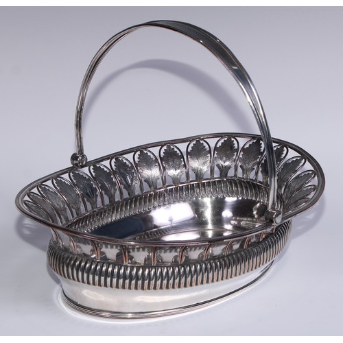 9 - A George III Old Sheffield Plate half-fluted oval swing-handled cake basket, pierced border with bri... 