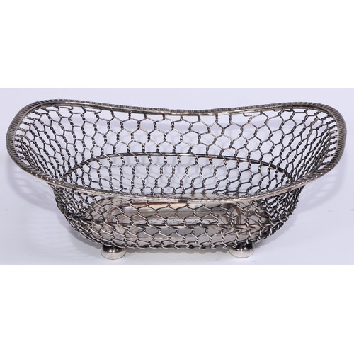 16 - A George III Old Sheffield Plate rope-twist wirework boat shaped cake basket, reeded borders and loo... 