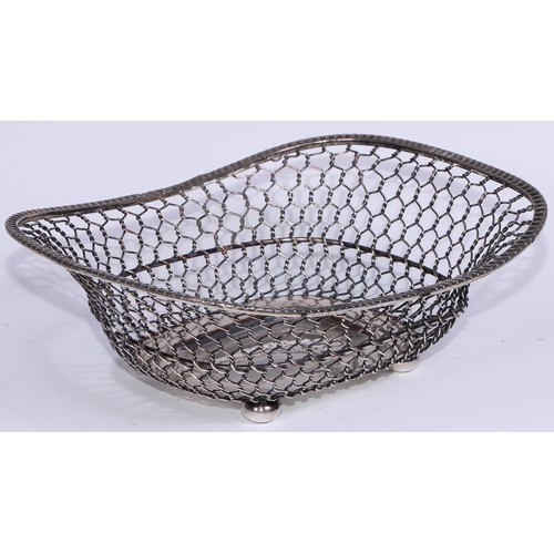 16 - A George III Old Sheffield Plate rope-twist wirework boat shaped cake basket, reeded borders and loo... 