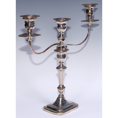 26 - A pair of George III Old Sheffield Plate three-light table candelabra, rectangular campana sconces, ... 