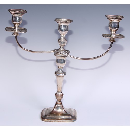 26 - A pair of George III Old Sheffield Plate three-light table candelabra, rectangular campana sconces, ... 