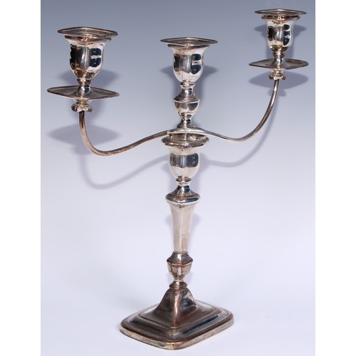 26 - A pair of George III Old Sheffield Plate three-light table candelabra, rectangular campana sconces, ... 