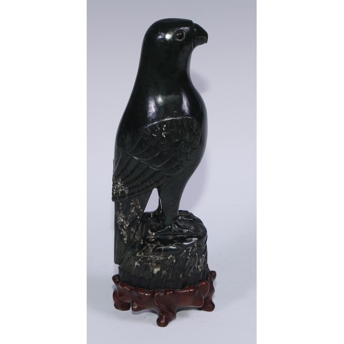 807 - A pair of Chinese jade carvings, of parrots, hardwood stands, 26.5cm high overall, 19th/early 20th c... 