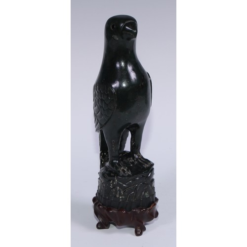 807 - A pair of Chinese jade carvings, of parrots, hardwood stands, 26.5cm high overall, 19th/early 20th c... 