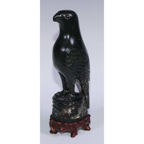 807 - A pair of Chinese jade carvings, of parrots, hardwood stands, 26.5cm high overall, 19th/early 20th c... 