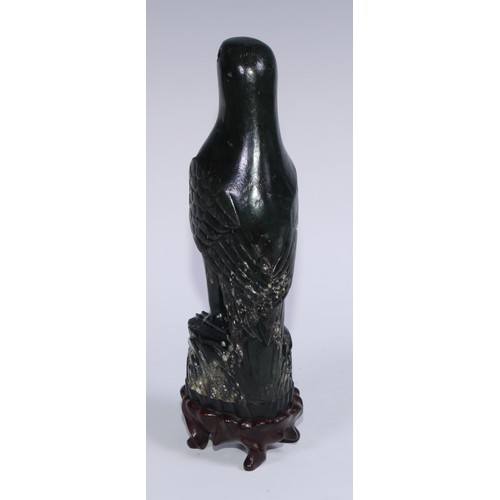 807 - A pair of Chinese jade carvings, of parrots, hardwood stands, 26.5cm high overall, 19th/early 20th c... 