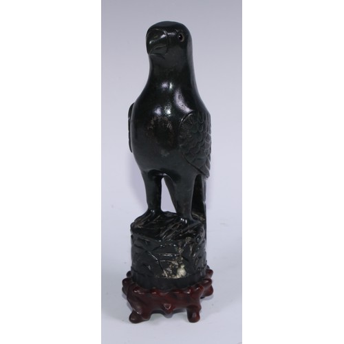 807 - A pair of Chinese jade carvings, of parrots, hardwood stands, 26.5cm high overall, 19th/early 20th c... 