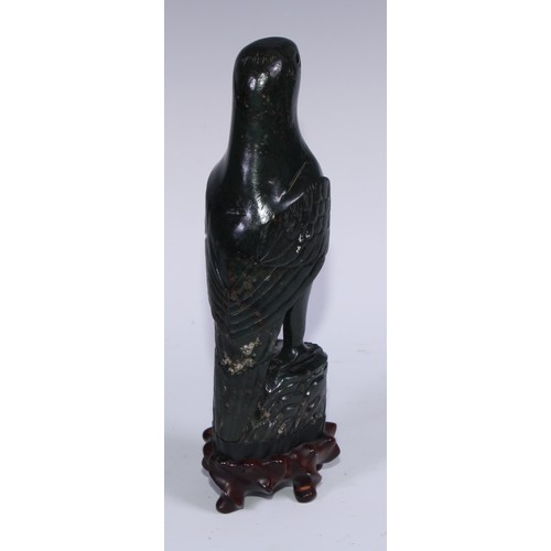 807 - A pair of Chinese jade carvings, of parrots, hardwood stands, 26.5cm high overall, 19th/early 20th c... 