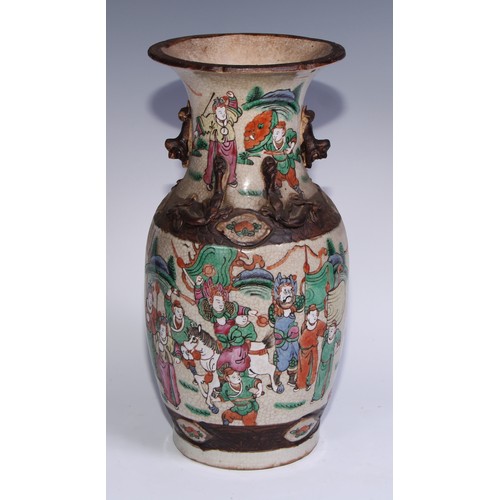 743 - A Chinese crackle glazed ovoid vase, painted in polychrome enamels with a battle scene, 35.5cm high,... 