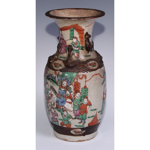 743 - A Chinese crackle glazed ovoid vase, painted in polychrome enamels with a battle scene, 35.5cm high,... 