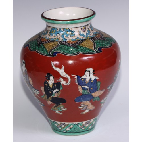 786 - A pair of Japanese ovoid vases, painted in polychrome with figures on a cinnabar ground, 26cm high, ... 